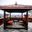 a gazebo with a table and chairs