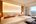 a room with two beds and a window