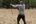 a man holding a bow and arrow