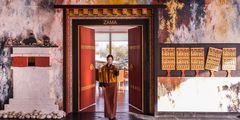 a woman standing in a doorway