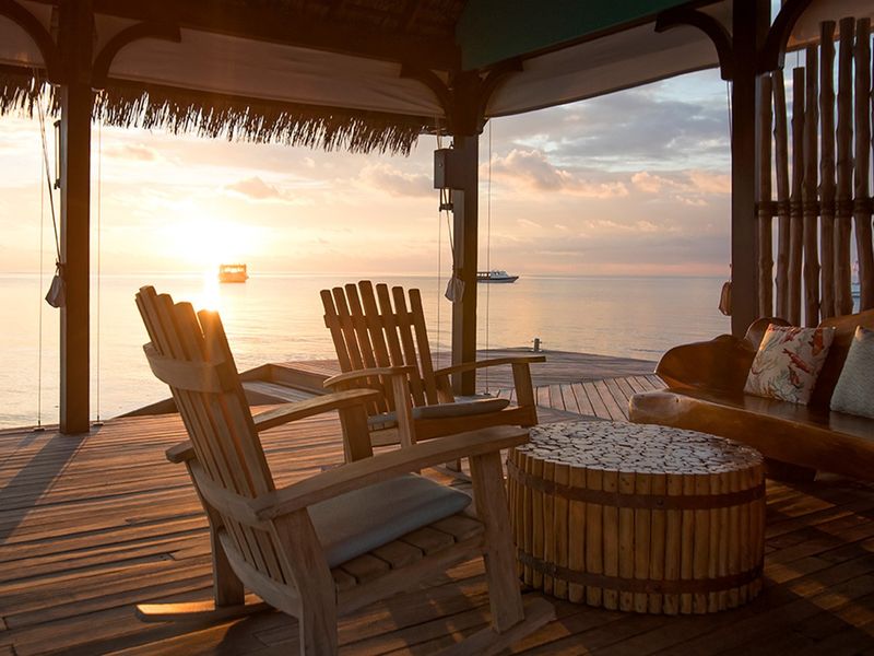 Terrace at sunset at Constance Moofushi