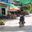 a man riding a motorcycle in a street
