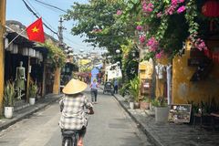 a person riding a bicycle on a street