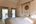 Double bedroom with balcony at Karnali Lodge