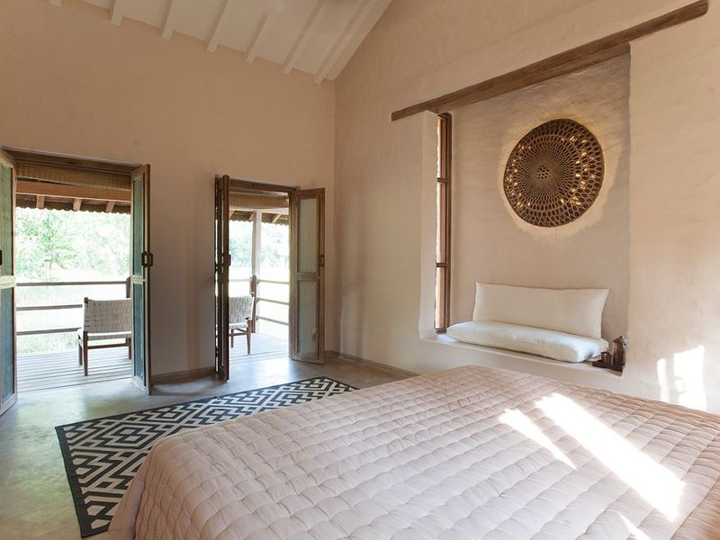 Double bedroom with balcony at Karnali Lodge