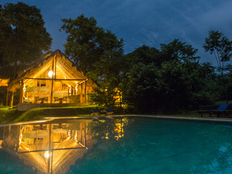 Swimming pool at night at Gal Oya Lodge