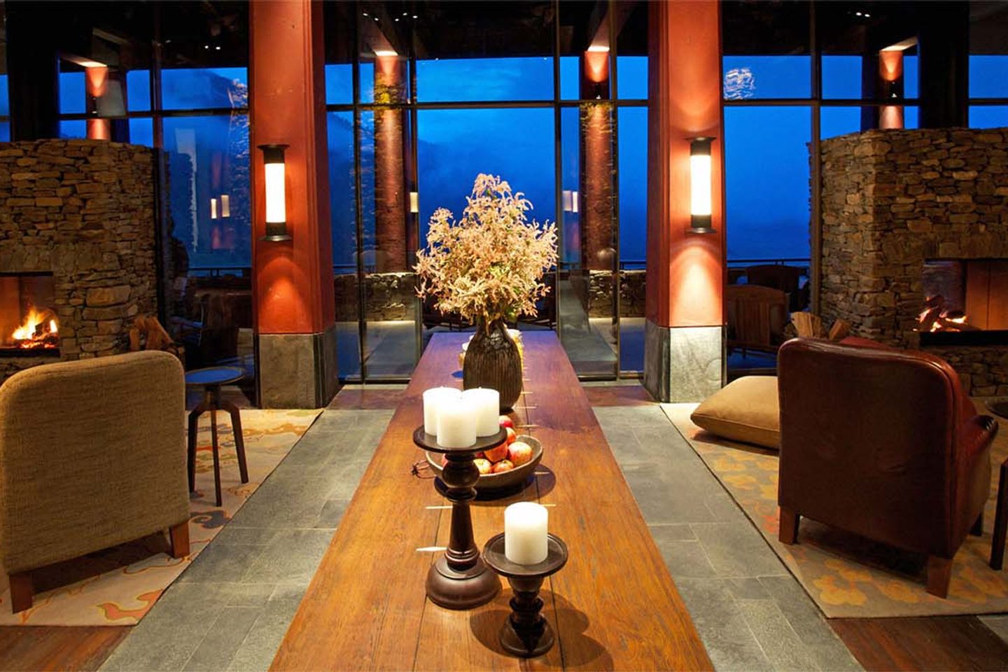 Armchairs by the fire at Gangtey Lodge