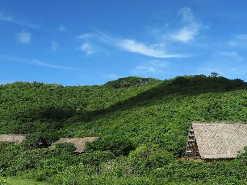 Bungalows rooftops at Jeeva Beloam Beach Camp Lombok Indonesia