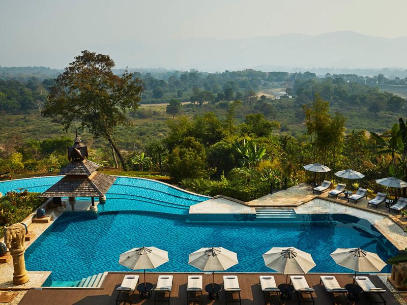 Infinity pool and green countryside views at Anantara Golden Triangle Elephant Camp
