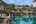 Pool with palm trees at Anantara Riverside