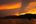 a sunset over a body of water