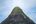 a mountain with a building on top