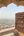 a view of a city from a stone arch