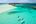 a couple of people on paddle boards in the water