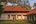 a house with a lawn and trees