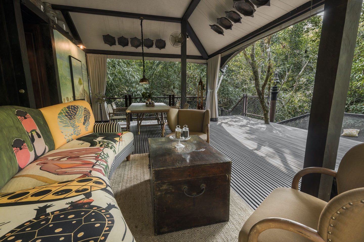 Seating area with colourful sofa at Shinta Mani Wild