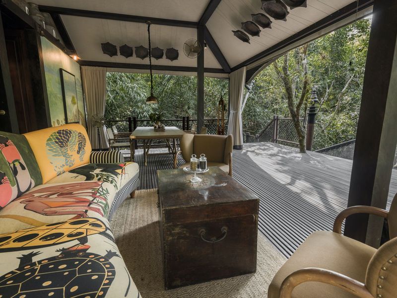Seating area with colourful sofa at Shinta Mani Wild