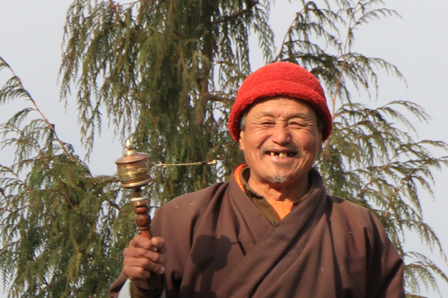 man with prayer wheel, Bhutan