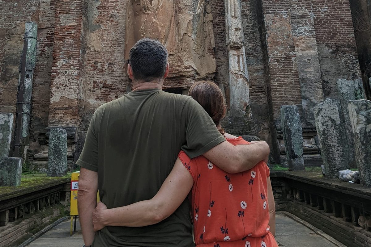 People hugging at a temple