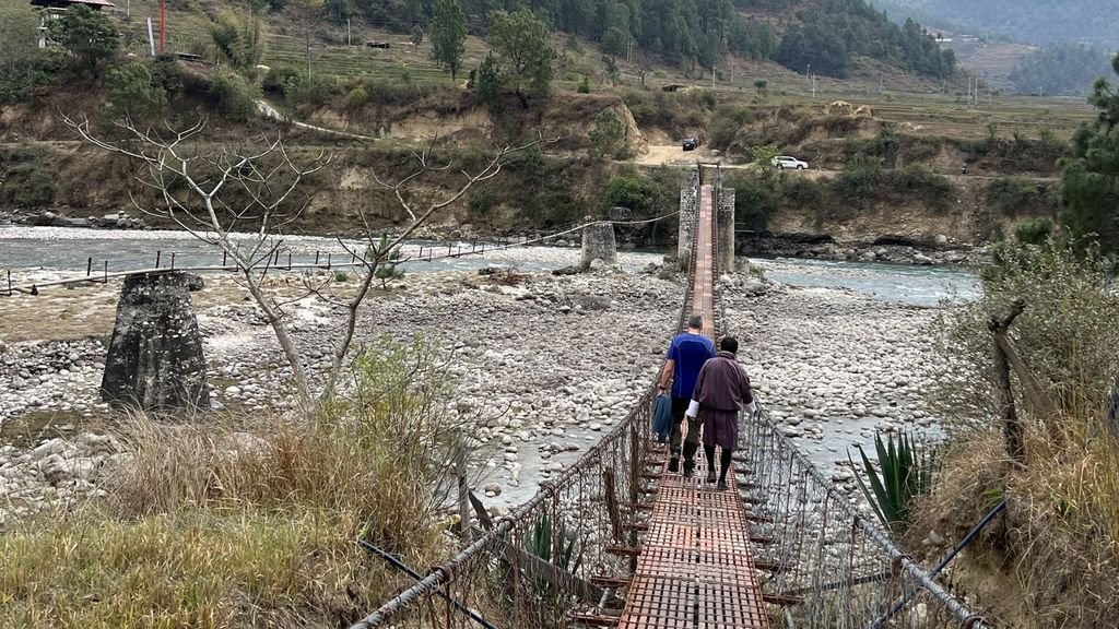 Crossing a bridge in Bhutan