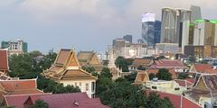 a group of buildings with trees and buildings in the background