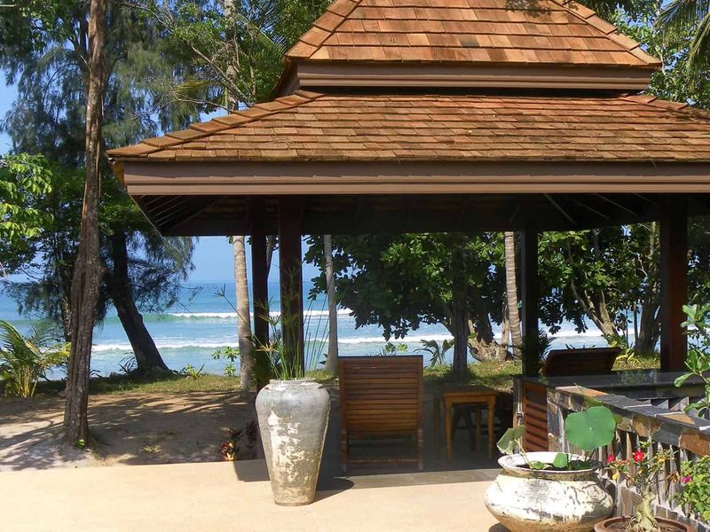 Loungers overlooking the beach at Koh Jum Beach Villas