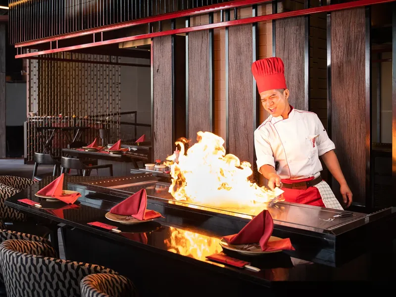 Chef cooking at Anantara Riverside