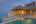 a house with a pool in the water
