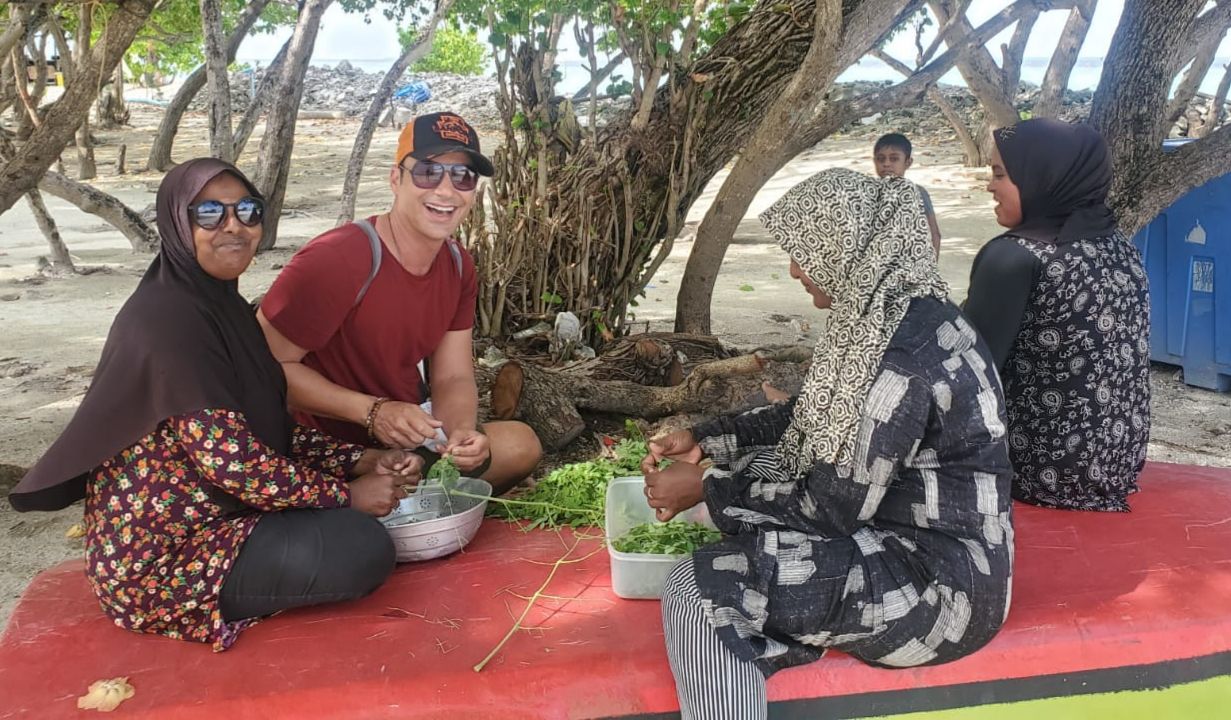 Tourist and local women in the Maldives