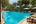 a swimming pool with palm trees
