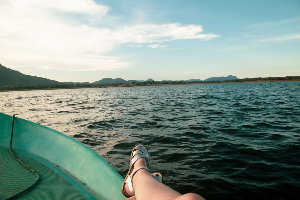 Feet crossed on the edge of a boat