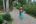 Woman walking through garden Indonesia