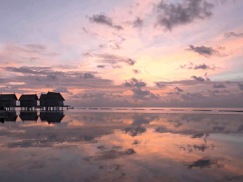 Sunset over the beach at Constance Moofushi