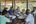 a group of people sitting around a table