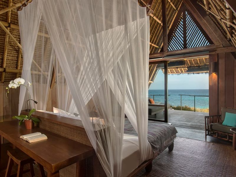 Canopy bed at Jeeva Beloam Beach Camp Lombok Indonesia