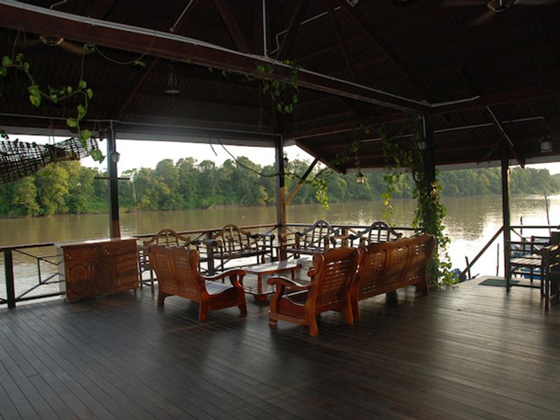 Seating area overlooking the river at Kinabatangan Riverside Lodge