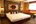 Double bed at Phumanee Lahu Home Hotel