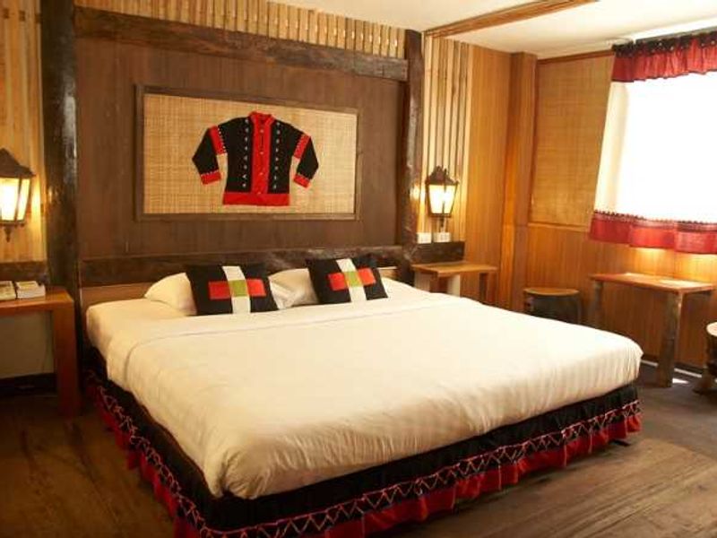 Double bed at Phumanee Lahu Home Hotel