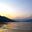 a body of water with mountains in the background