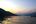 a body of water with mountains in the background