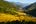 a valley with a river and hills