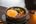 a bowl of food with a fried egg