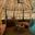 a room with two beds and a hammock