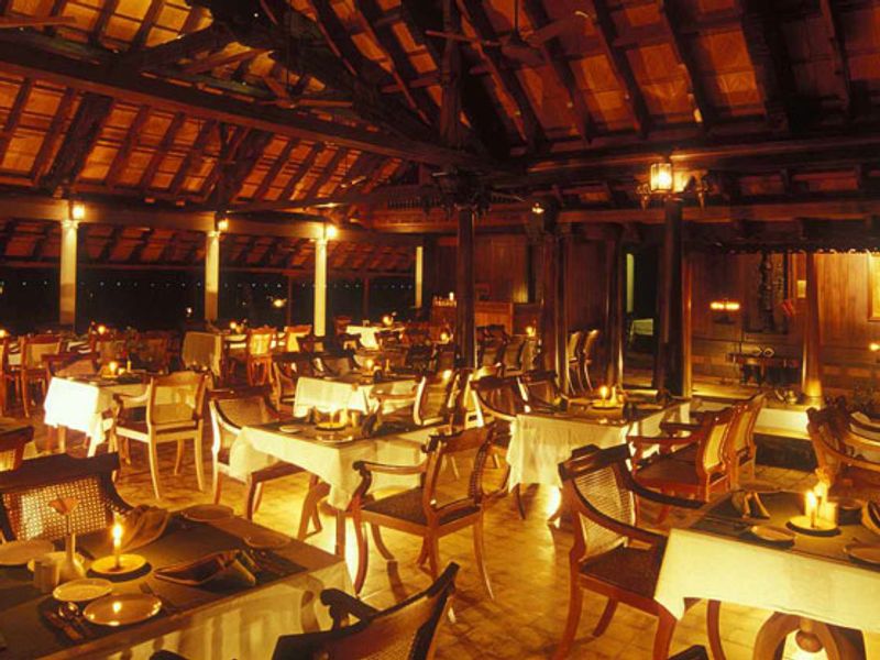 Restaurant at night at Kumarakom Lake Resort
