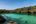 a body of water with a dock and trees
