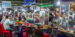 A man choosing ingredients at a Cambodian market