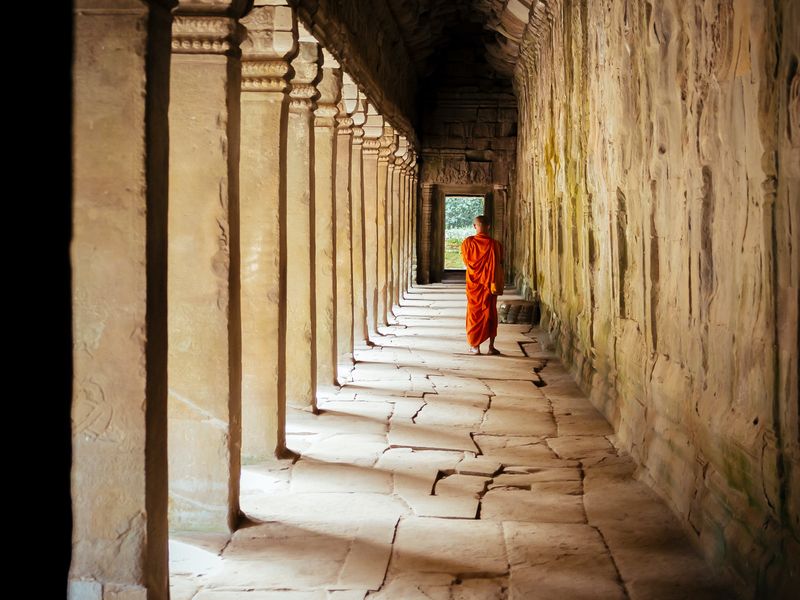 Monk walking through a temple Cambodia