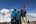 a group of people standing on a mountain top