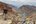 a group of people walking on a mountain