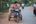 a man riding a motorcycle on a road